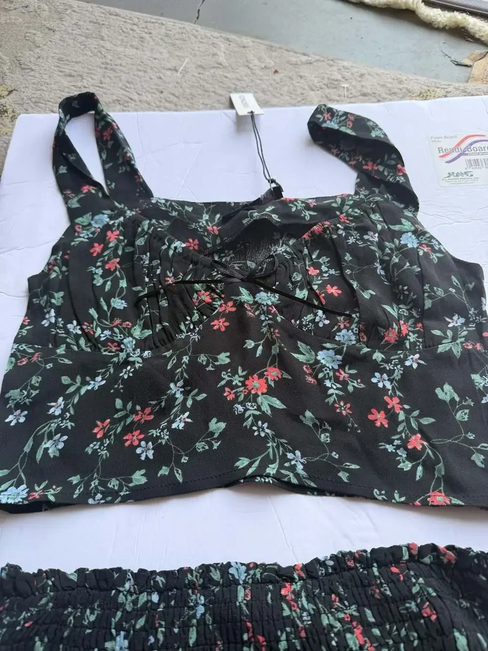 Olivaceous Black Floral Two-Piece Set with Smocked Ruffle Skirt and Crop Top